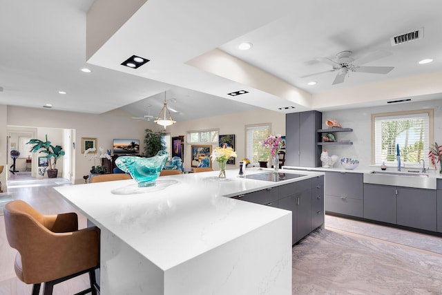 3300 Riviera Dr, Key West, FL 33040 - kitchen featuring a sink, ceiling fan, gray cabinets, a large island, and open shelves