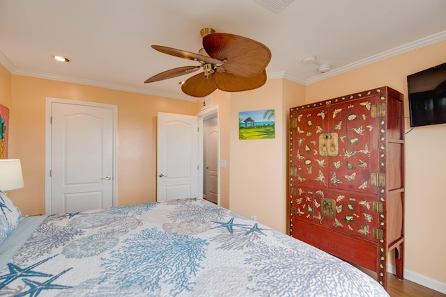 bedroom featuring ornamental molding and ceiling fan