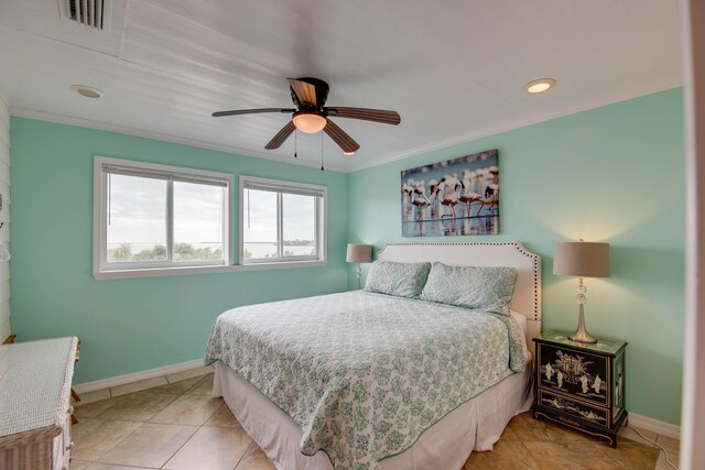 bedroom with ornamental molding, light tile patterned floors, and ceiling fan