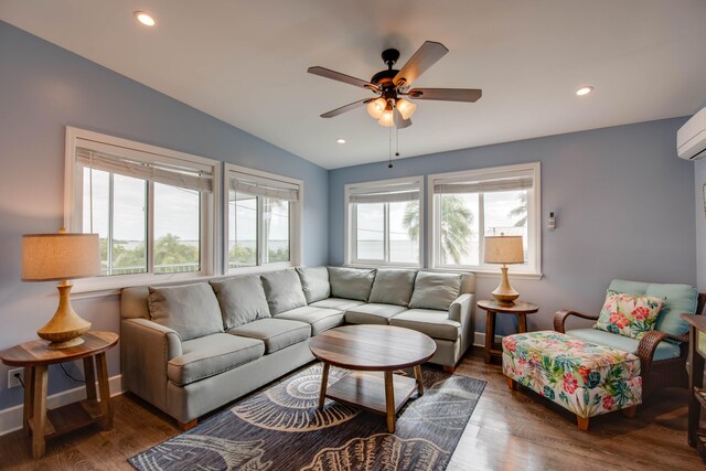 living room with ceiling fan, lofted ceiling, and dark hardwood / wood-style floors