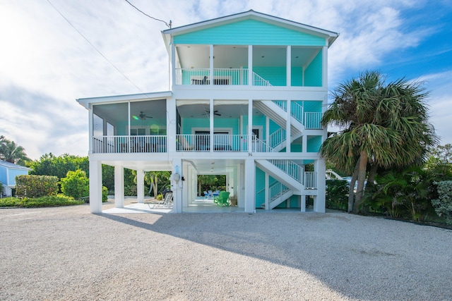 view of front of home with a carport and ceiling fan