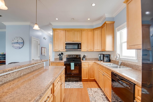 kitchen featuring pendant lighting, sink, black appliances, light brown cabinets, and light wood-type flooring