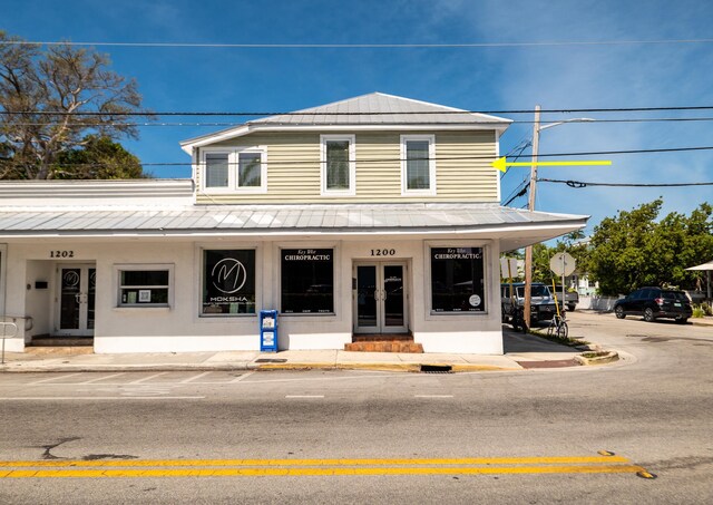 1124 Catherine St Unit 201, Key West, FL 33040 - view of front of home with a porch and metal roof