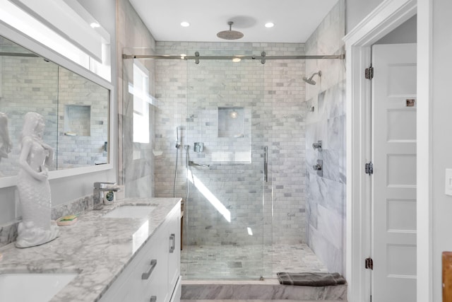 bathroom featuring vanity and walk in shower