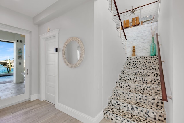 staircase featuring hardwood / wood-style flooring