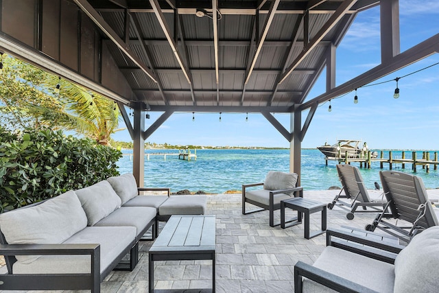 view of patio / terrace featuring outdoor lounge area and a water view