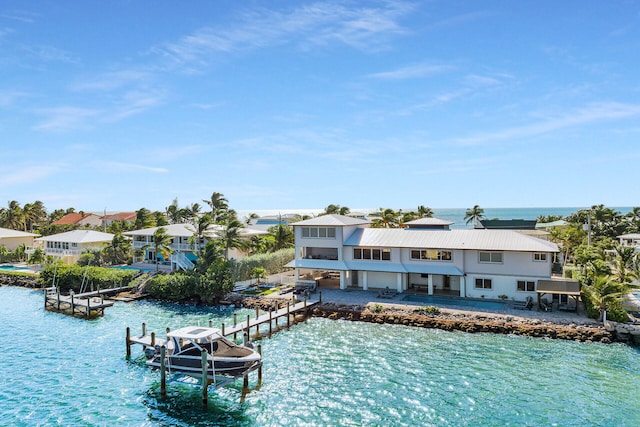 exterior space with a patio and a water view