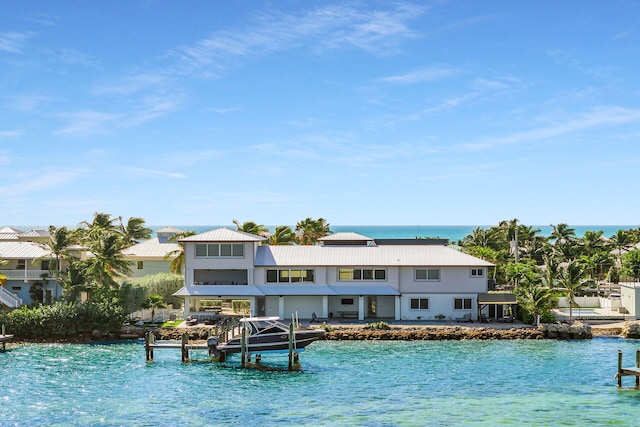 view of pool featuring a boat dock and a water view