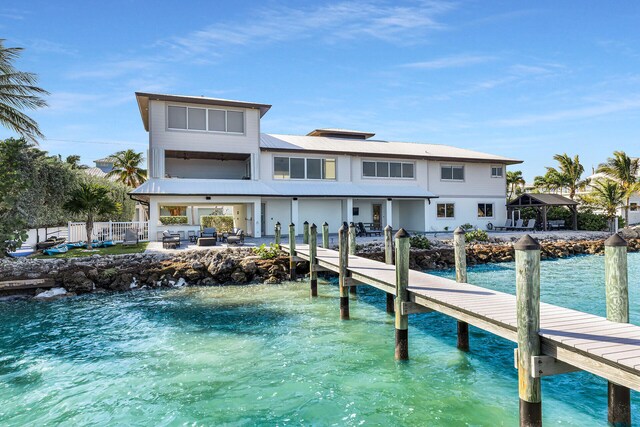 back of house with a water view