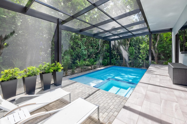 view of swimming pool with an in ground hot tub and a patio area