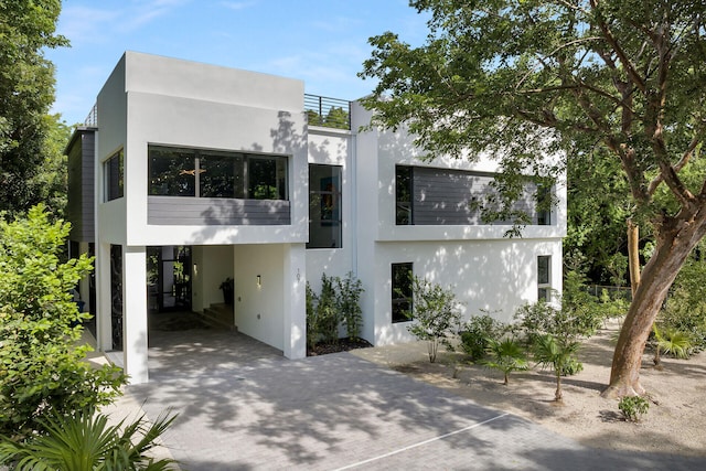 view of front of home with a carport