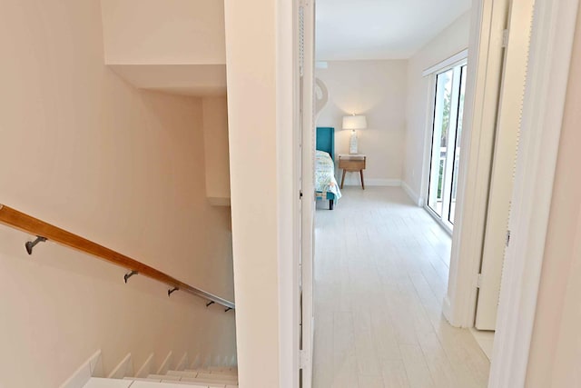 corridor with light hardwood / wood-style flooring