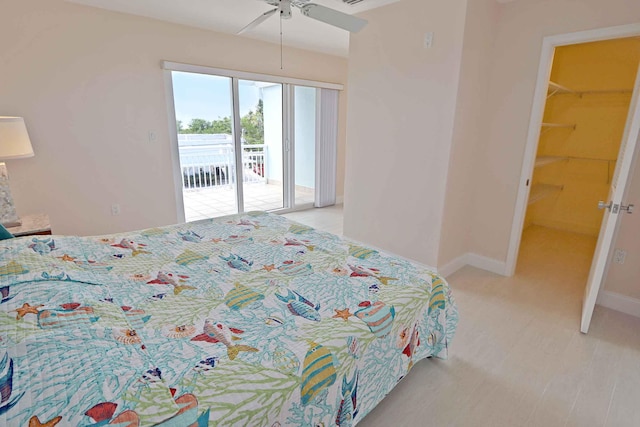 bedroom with light hardwood / wood-style flooring, access to outside, and ceiling fan