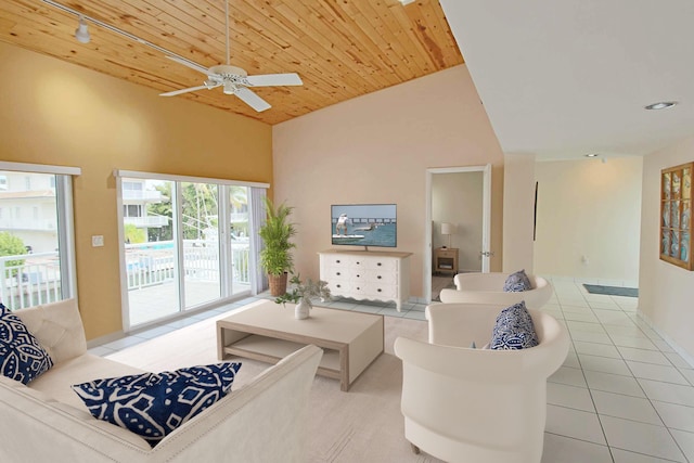 living room with light tile patterned floors, wood ceiling, track lighting, and high vaulted ceiling