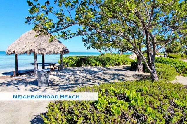 surrounding community featuring a gazebo and a water view