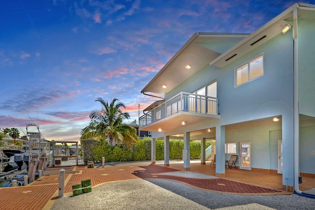 exterior space featuring a patio area and a balcony