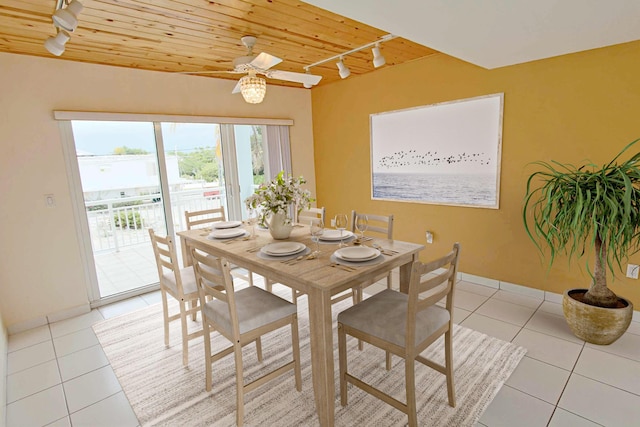 dining space with rail lighting, light tile patterned floors, wooden ceiling, and ceiling fan