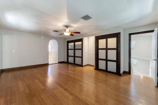 spare room with ceiling fan and light hardwood / wood-style flooring