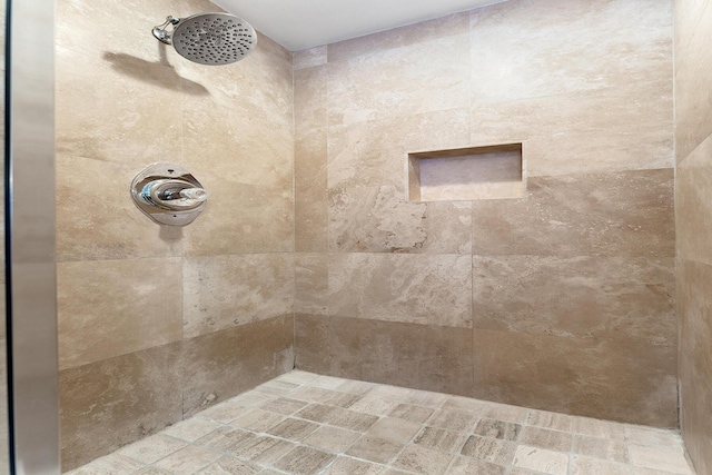 bathroom featuring tiled shower