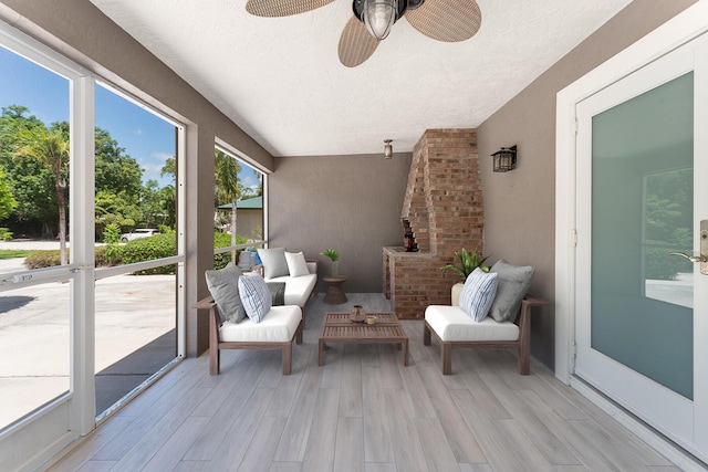 sunroom / solarium with ceiling fan