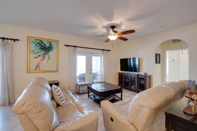 living room featuring french doors, ceiling fan, and light tile patterned flooring