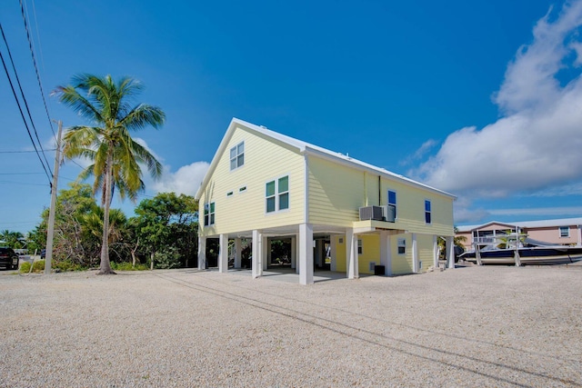 view of property exterior with a carport and central air condition unit