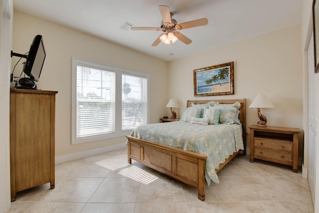 bedroom with light tile patterned floors and ceiling fan