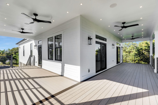 wooden terrace featuring a ceiling fan