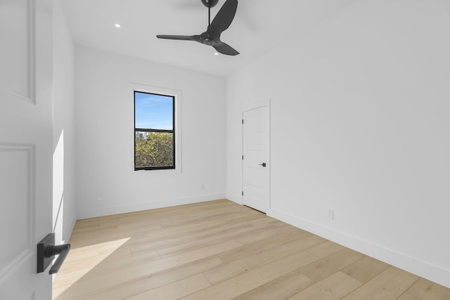 spare room with a ceiling fan, recessed lighting, baseboards, and light wood finished floors