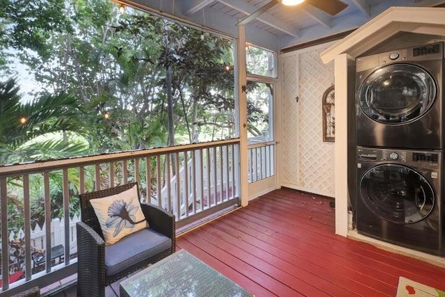 exterior space featuring stacked washer and clothes dryer