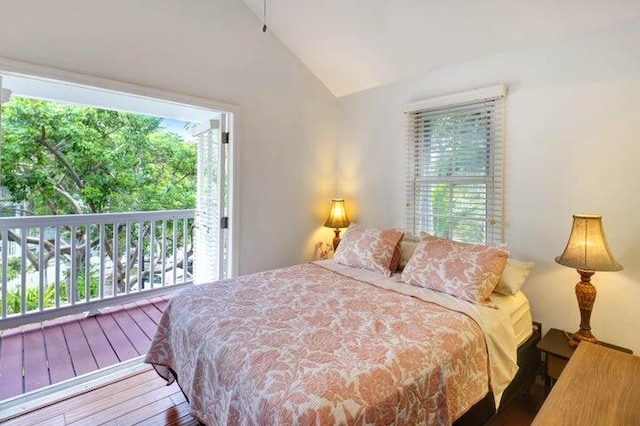 bedroom featuring lofted ceiling and wood-type flooring