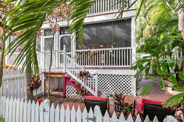 view of patio with a sunroom