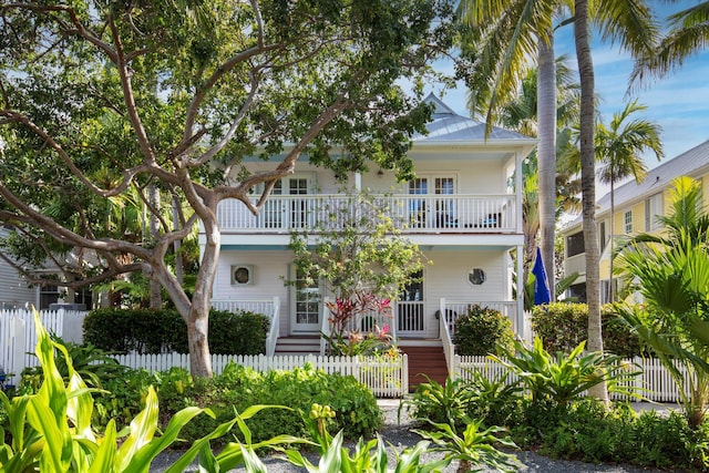 view of front of property with a balcony and covered porch