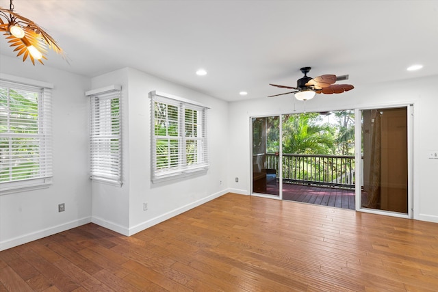 spare room featuring hardwood / wood-style floors and ceiling fan