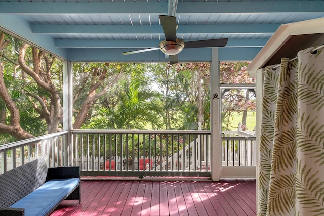 exterior space with beam ceiling and ceiling fan