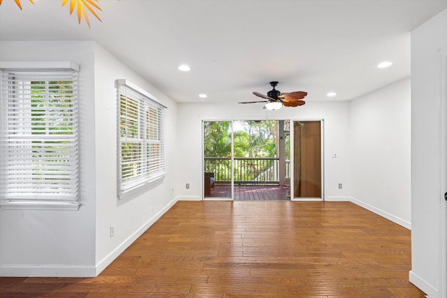 unfurnished room featuring hardwood / wood-style floors and ceiling fan