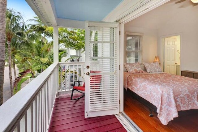 exterior space with hardwood / wood-style flooring and floor to ceiling windows