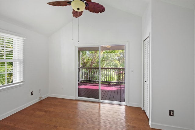 spare room with ceiling fan, wood-type flooring, and vaulted ceiling