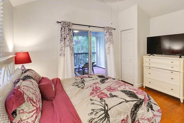 bedroom featuring hardwood / wood-style flooring and access to exterior