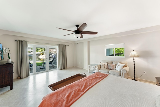 bedroom with access to outside and ceiling fan