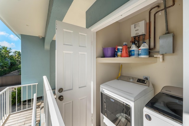 washroom with plenty of natural light and separate washer and dryer