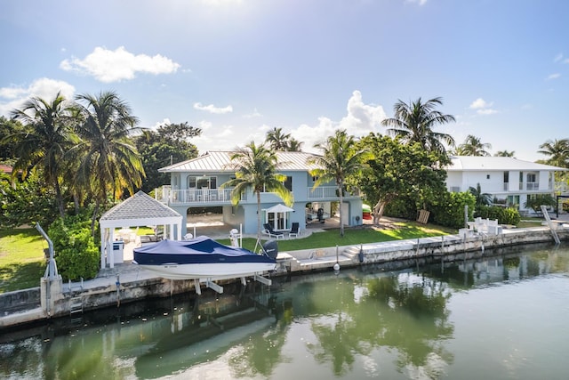 dock area featuring a balcony and a water view