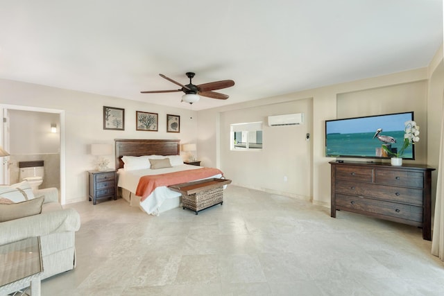 bedroom featuring ceiling fan, a wall mounted AC, and ensuite bath