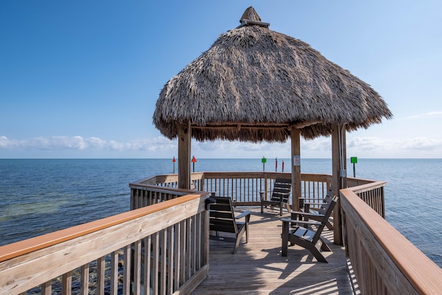 dock area with a gazebo and a water view