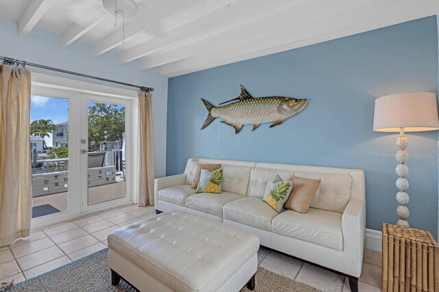 living room featuring radiator heating unit, beam ceiling, and light tile patterned floors