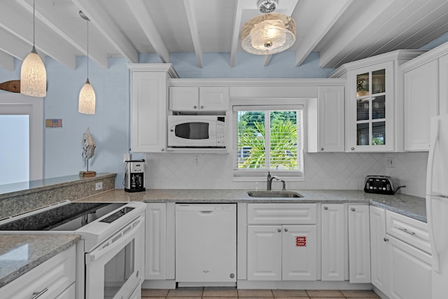 kitchen with sink, white appliances, white cabinetry, light stone counters, and beamed ceiling