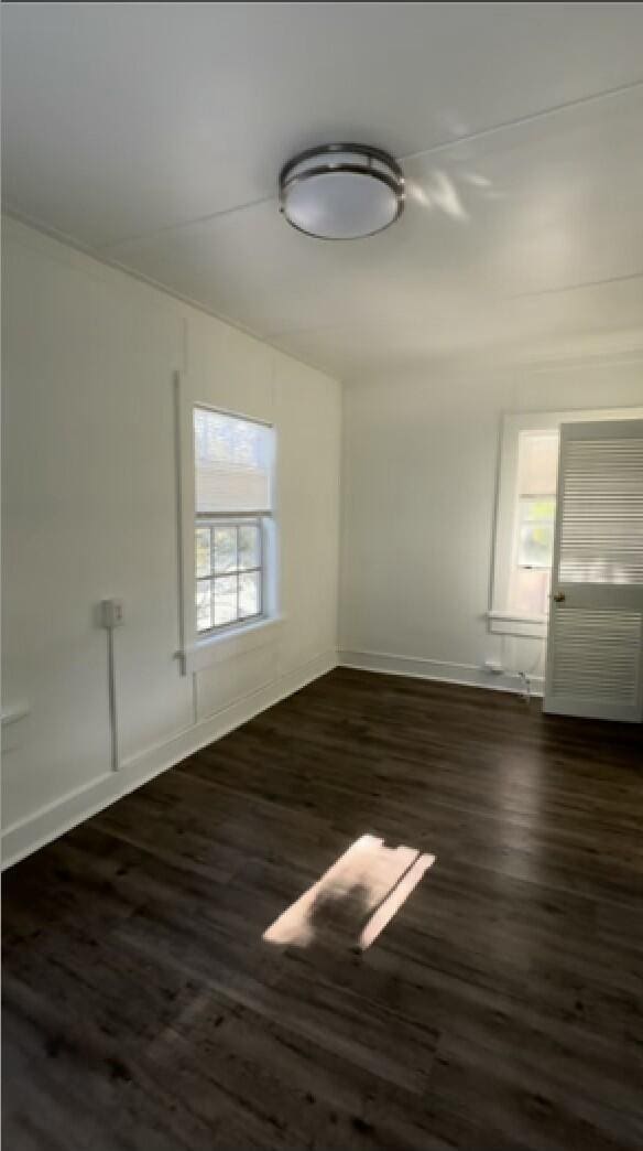 1415 United St, Key West, FL 33040 - spare room featuring dark hardwood / wood-style flooring