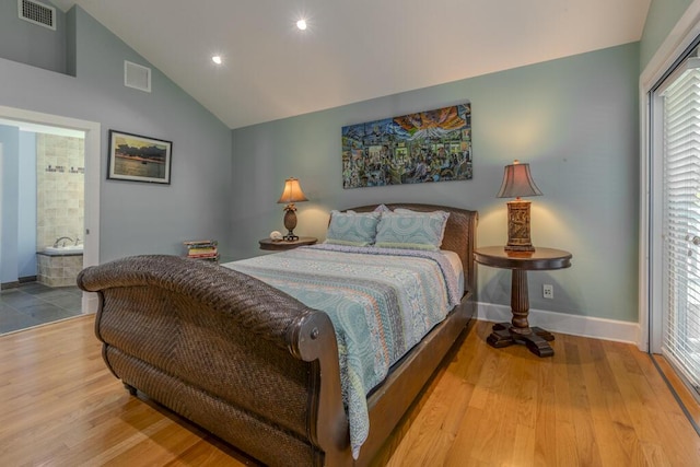 810 Terry Ln, Key West, FL 33040 - bedroom featuring lofted ceiling, wood finished floors, recessed lighting, and ensuite bath