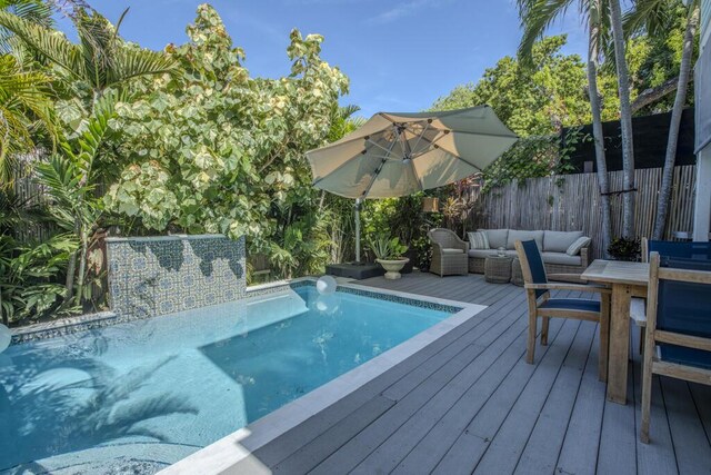 810 Terry Ln, Key West, FL 33040 - view of swimming pool featuring a deck, outdoor dining space, and an outdoor living space