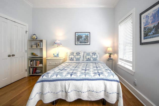 810 Terry Ln, Key West, FL 33040 - bedroom featuring ornamental molding, wood finished floors, multiple windows, and a closet